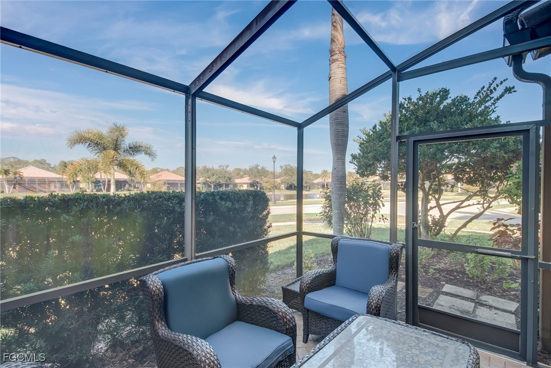 11856 Rocio Street, Unit 2003 Fort Myers, FL 33912 - Photo 15 of 43 a view of a chair and tables in the balcony
