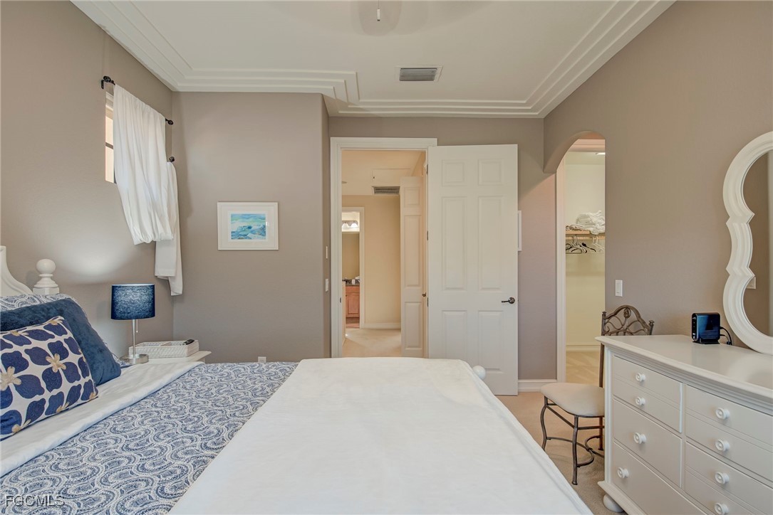 11856 Rocio Street, Unit 2003 Fort Myers, FL 33912 - Photo 18 of 43 a bedroom with a bed and a dresser