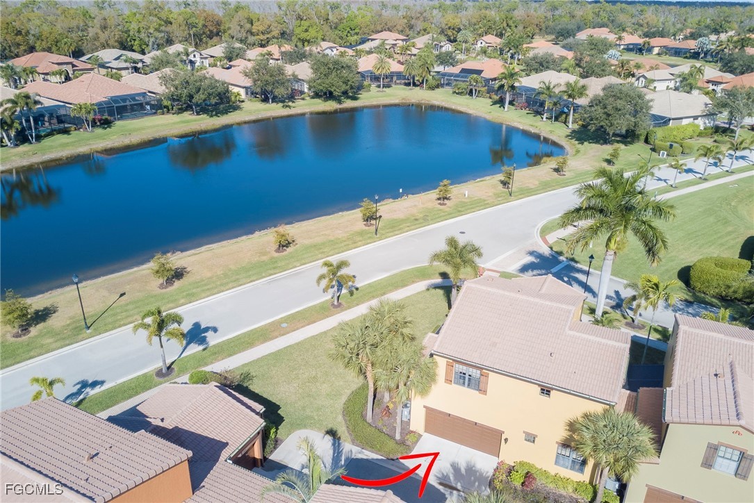 11856 Rocio Street, Unit 2003 Fort Myers, FL 33912 - Photo 26 of 43 an aerial view of residential houses with outdoor space