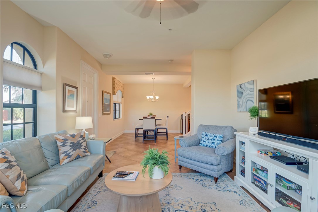 11856 Rocio Street, Unit 2003 Fort Myers, FL 33912 - Photo 4 of 43 a living room with furniture and a flat screen tv