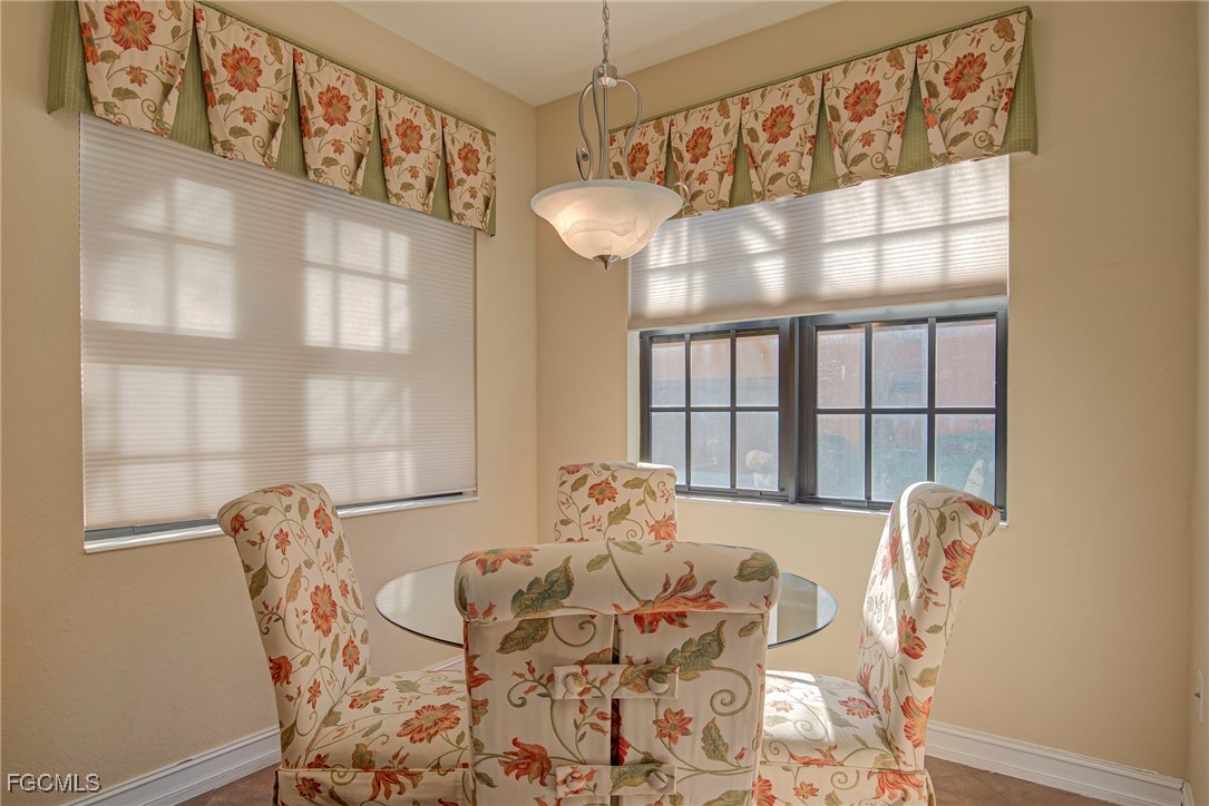 11856 Rocio Street, Unit 2003 Fort Myers, FL 33912 - Photo 9 of 43 a dining room with furniture and window