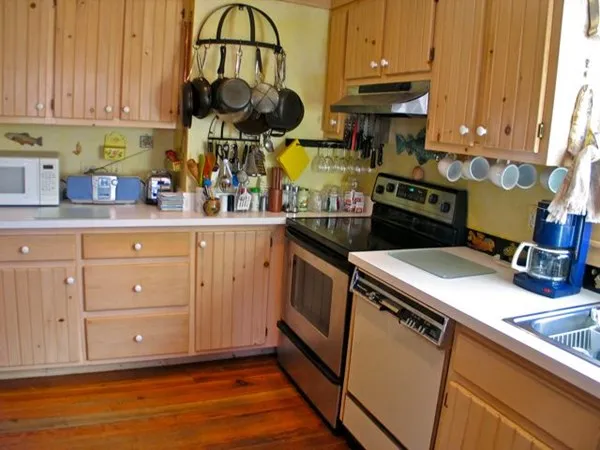 a kitchen with a sink cabinets and window