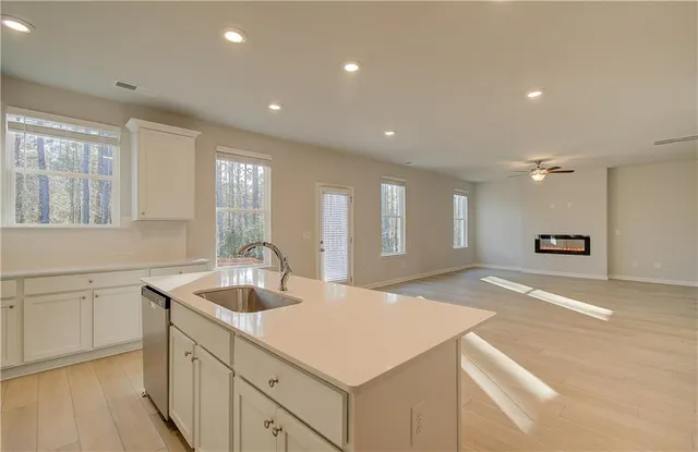 a kitchen with sink and refrigerator
