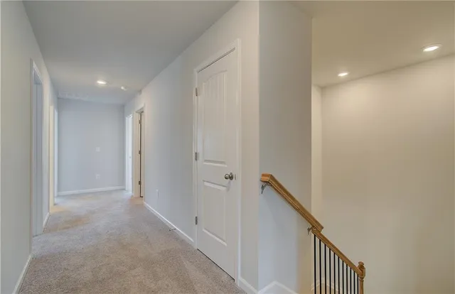 a view of a hallway with stairs