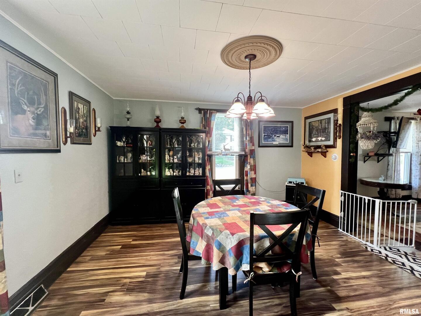 209 Northwest 6th Street Aledo, IL 61231 - Photo 11 of 28 a view of a dining room with furniture and wooden floor