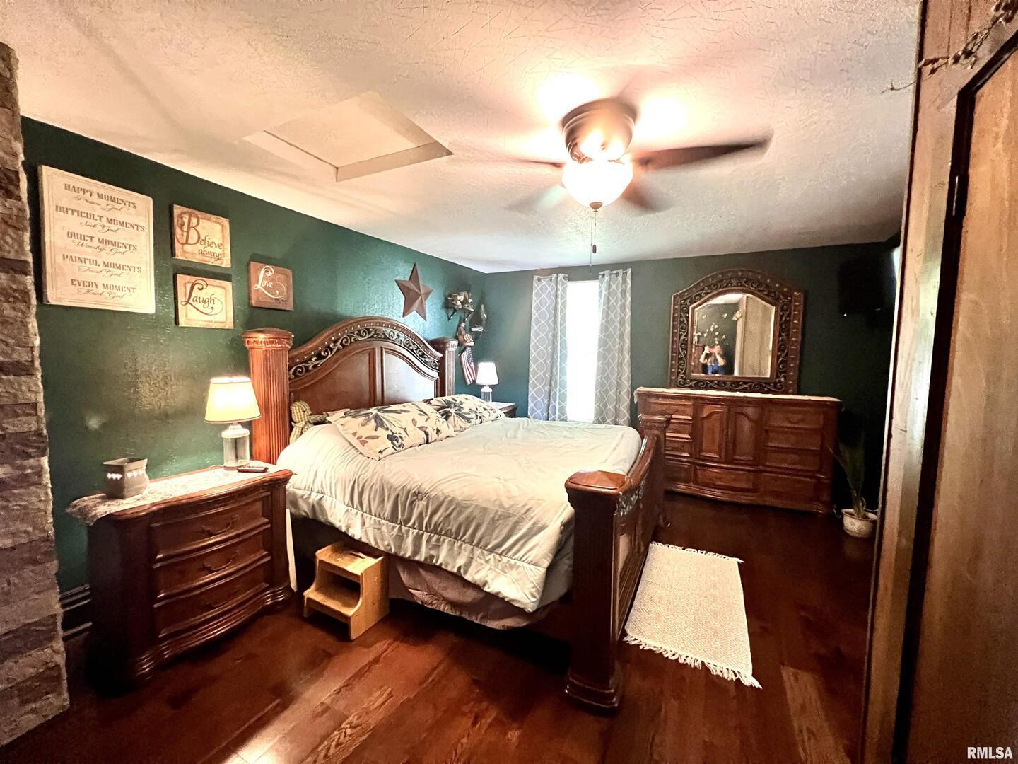 209 Northwest 6th Street Aledo, IL 61231 - Photo 17 of 28 a bed room with a bed and a mirror