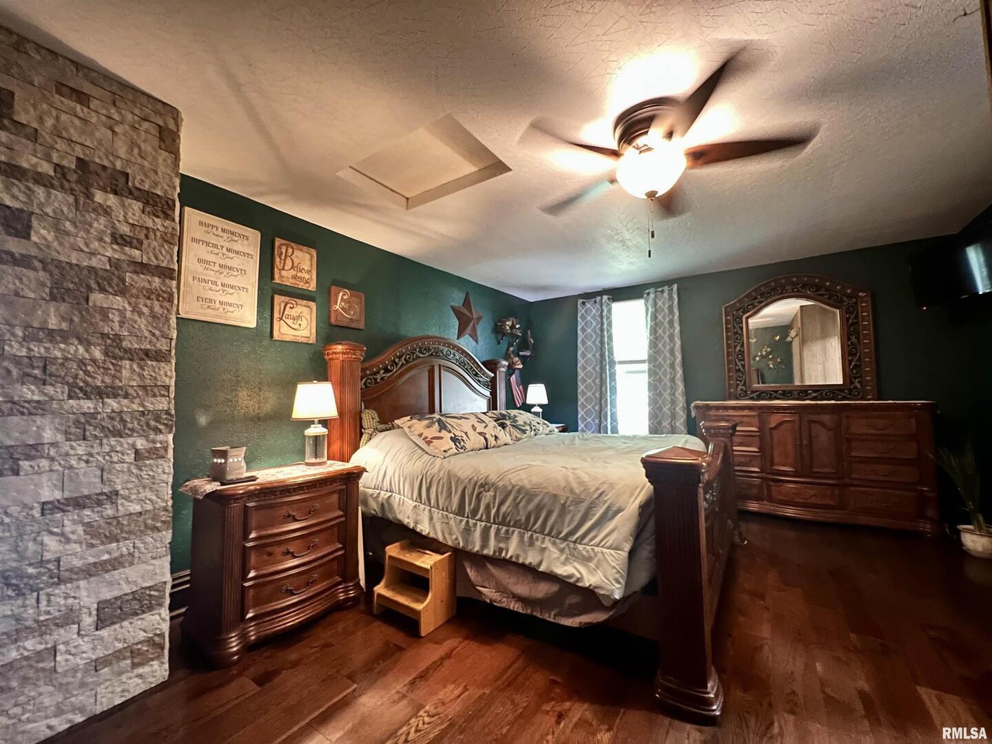 209 Northwest 6th Street Aledo, IL 61231 - Photo 19 of 28 a bedroom with a bed window and dresser