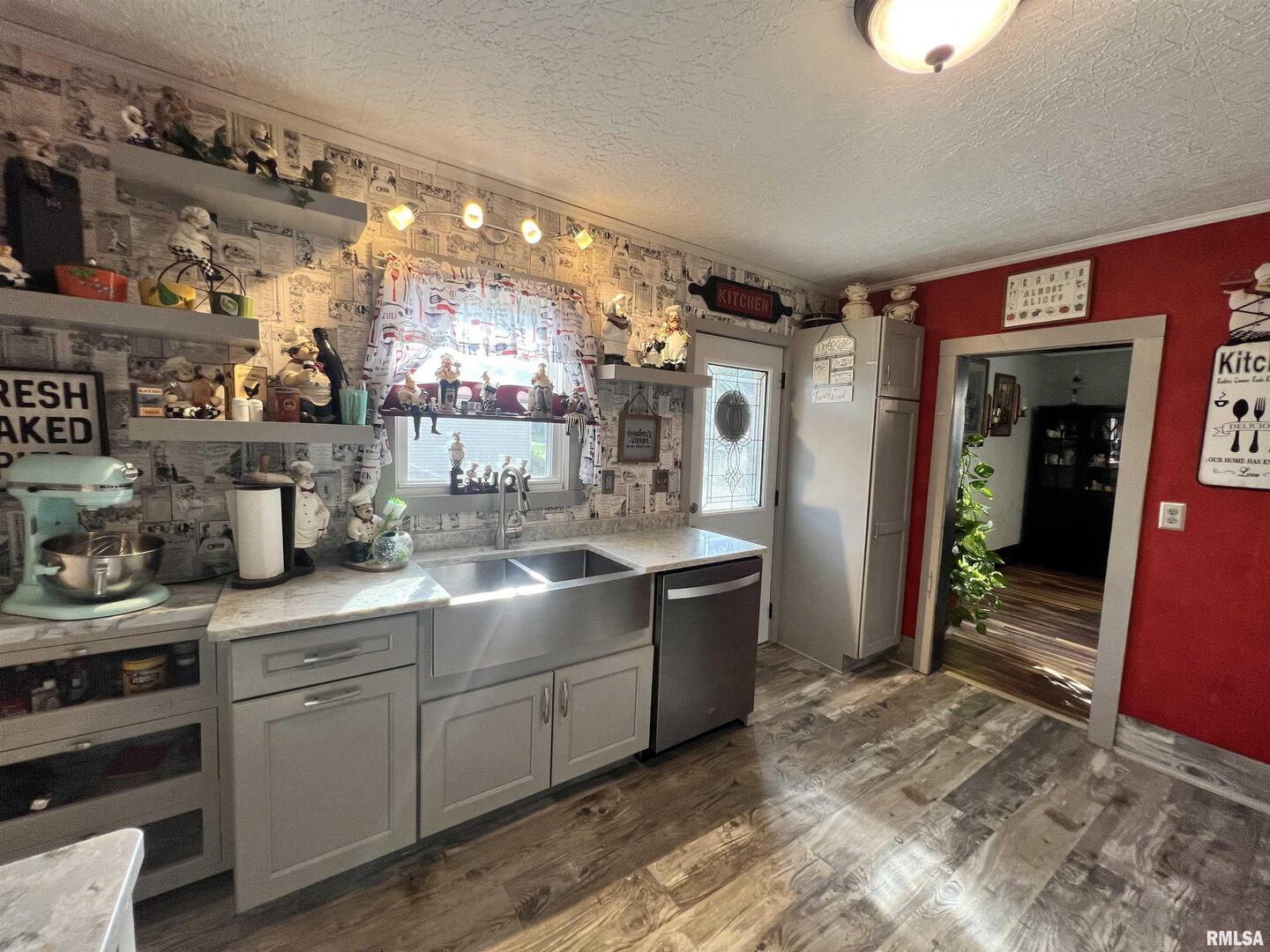 209 Northwest 6th Street Aledo, IL 61231 - Photo 7 of 28 a kitchen with sink and cabinets