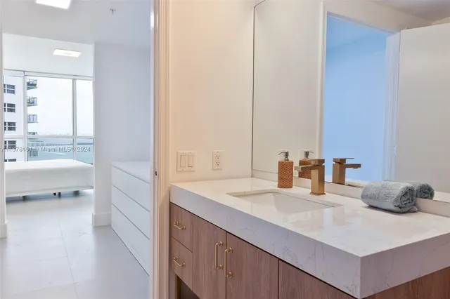 a bathroom with a sink and a mirror