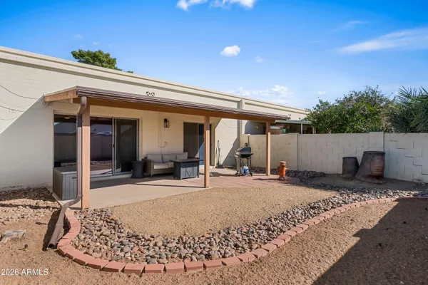 a view of living room filled with furniture and a potted plant