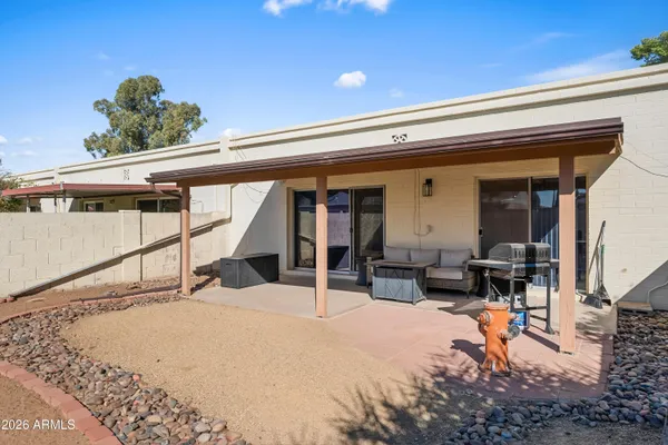 a view of a swimming pool with an outdoor seating