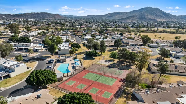 an aerial view of residential houses with outdoor space