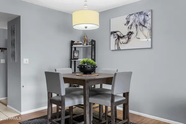 a view of a dining room with furniture and wooden floor