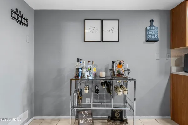 a dining room with table and chairs