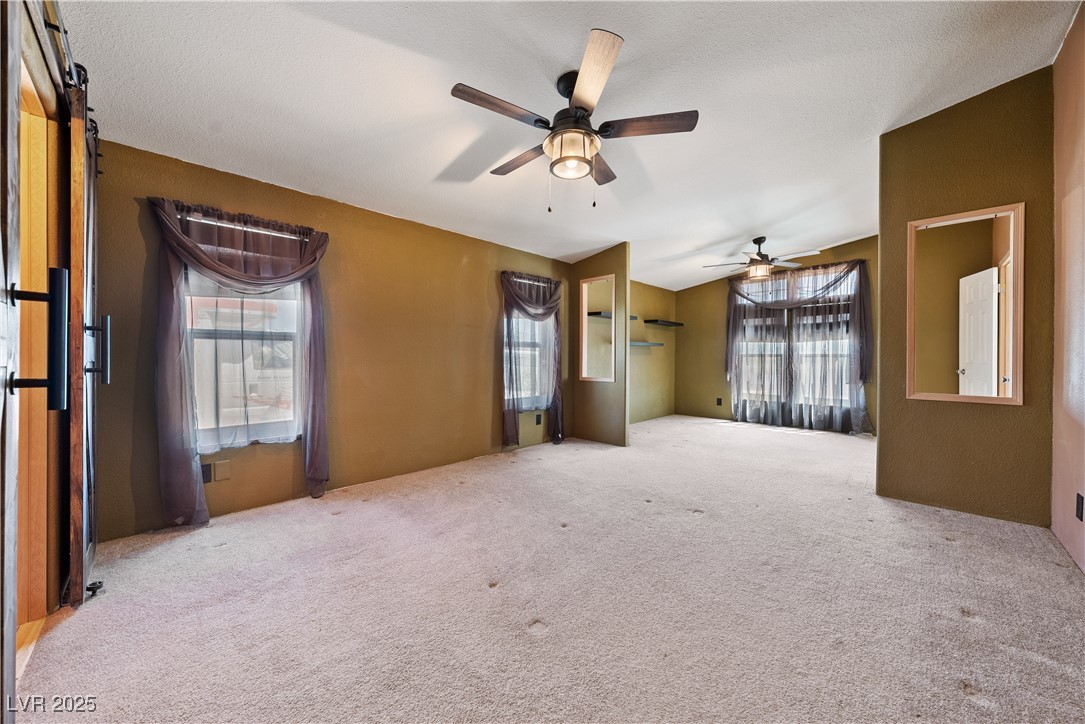 1391 East Casey Road Pahrump, NV 89048 - Photo 23 of 40 Primary room with carpet and ceiling fan