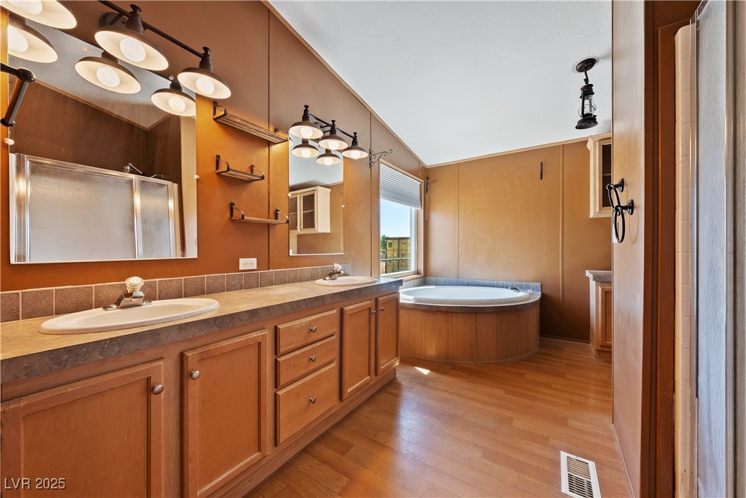 1391 East Casey Road Pahrump, NV 89048 - Photo 26 of 40 Full bathroom featuring vaulted ceiling, a shower
