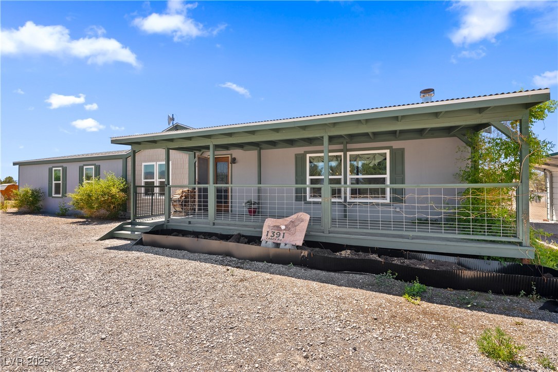 1391 East Casey Road Pahrump, NV 89048 - Photo 3 of 40 Front of property with covered porch.