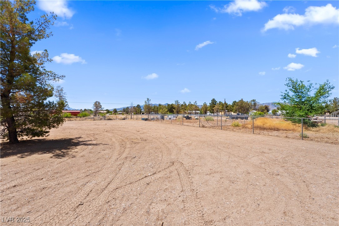 1391 East Casey Road Pahrump, NV 89048 - Photo 33 of 40 View of yard with fence and a view of countryside