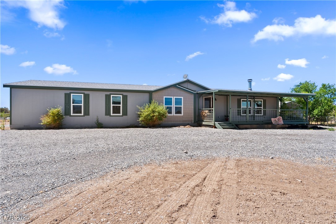 1391 East Casey Road Pahrump, NV 89048 - Photo 39 of 40 Ranch-style home featuring covered porch