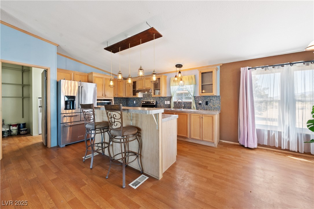 1391 East Casey Road Pahrump, NV 89048 - Photo 8 of 40 Kitchen with stainless steel appliances, light woo