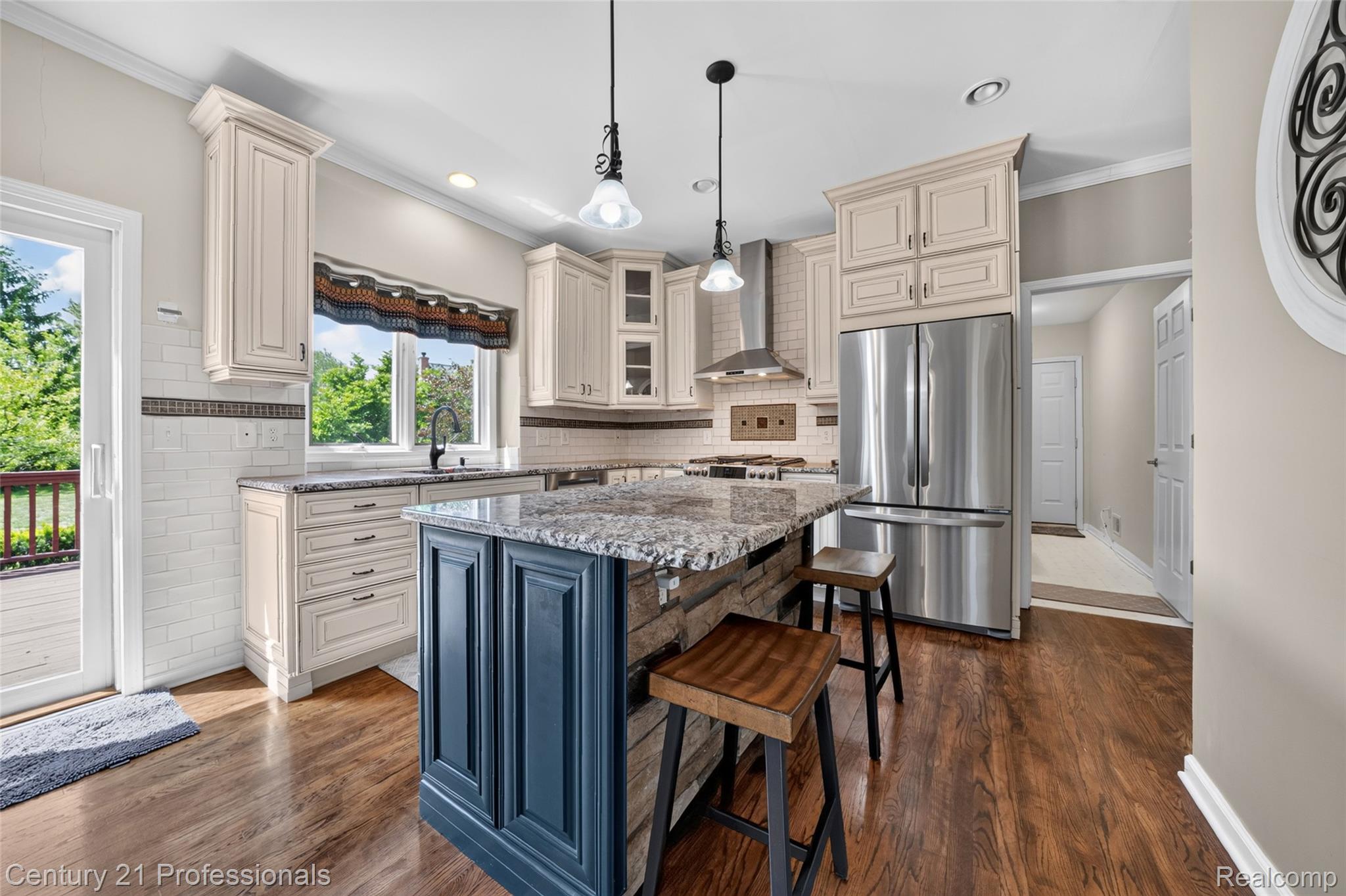 1892 Ring Neck Drive Rochester, MI 48307 - Photo 7 of 47 Open Kitchen space with hardwood floors and seating at island