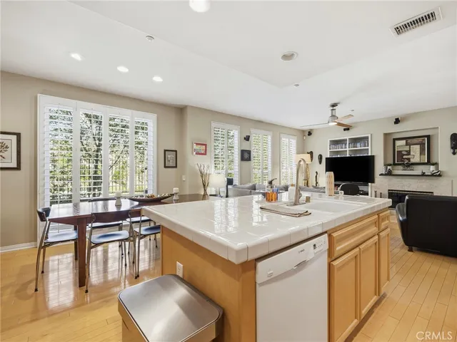 a open kitchen with stainless steel appliances granite countertop a sink and cabinets