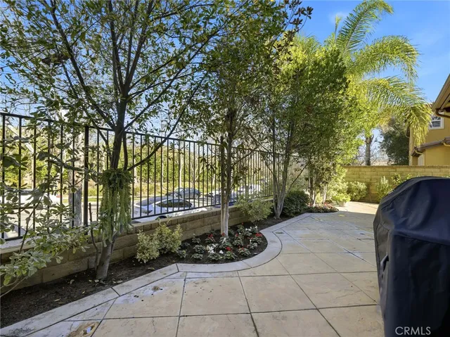 a view of a chair and table in the backyard
