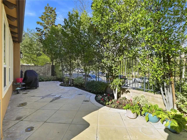 a view of a backyard with large trees
