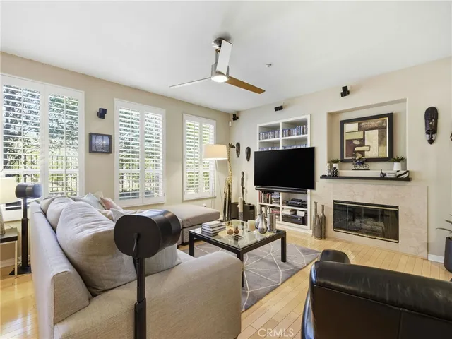 a living room with furniture flat screen tv and a fireplace