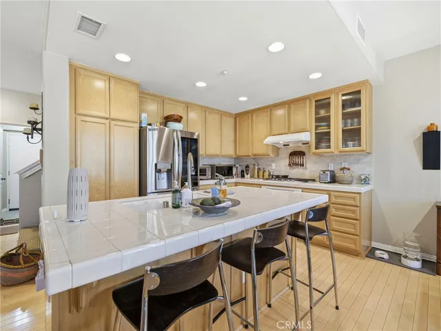 a kitchen with counter top space cabinets and stainless steel appliances