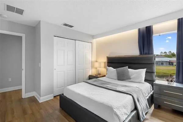 a bedroom with a bed and a window