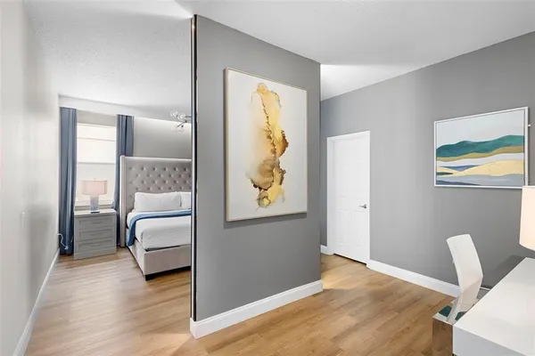 a bedroom with furniture and a window