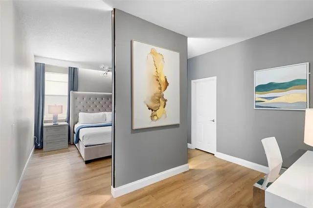 a bedroom with furniture and a window