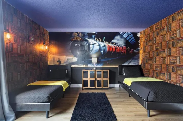 a view of a balcony with a couch and wooden floor