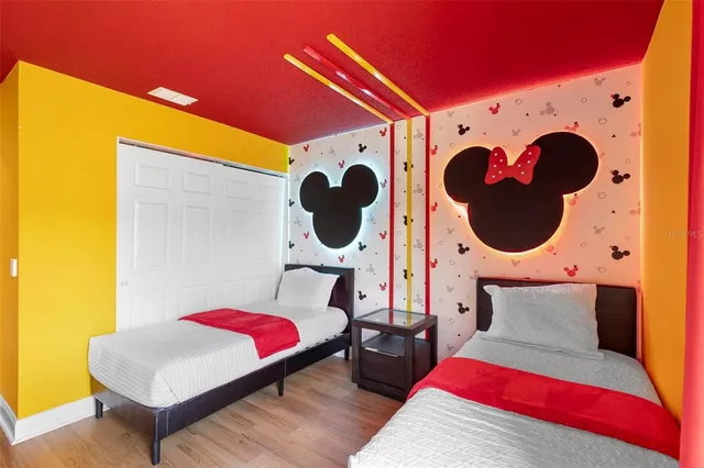 a living room with a bed furniture and a large window