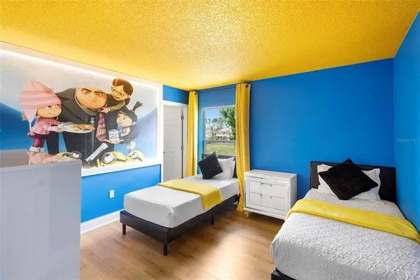 a bedroom with a bed and dresser