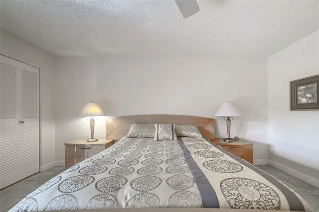 a bed room with a bed and a lamp