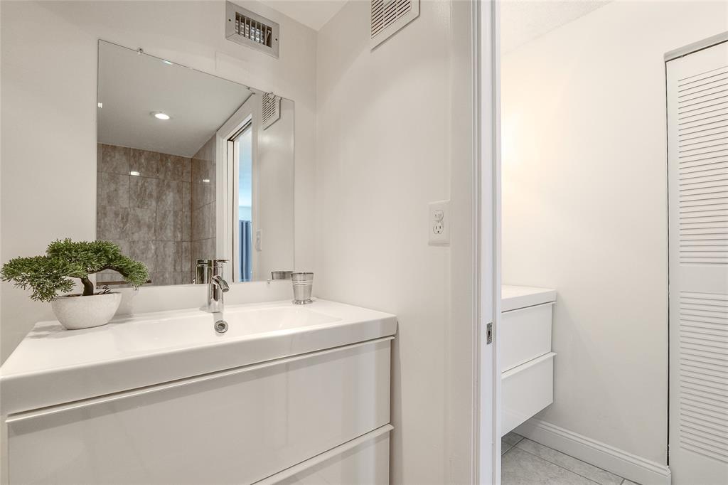 6100 Northwest 44th Street, Unit 307 Lauderhill, FL 33319 - Photo 20 of 54 a bathroom with a sink and a mirror