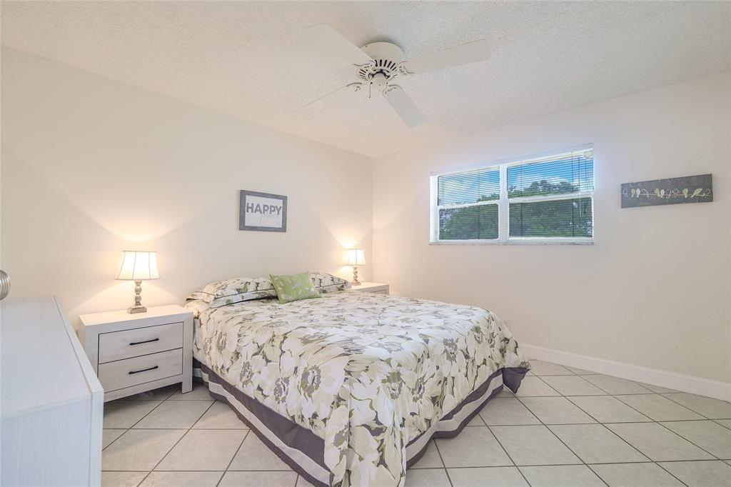 6100 Northwest 44th Street, Unit 307 Lauderhill, FL 33319 - Photo 21 of 54 a bedroom with a bed and a window