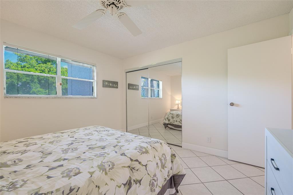 6100 Northwest 44th Street, Unit 307 Lauderhill, FL 33319 - Photo 25 of 54 a bedroom with a bed and a window