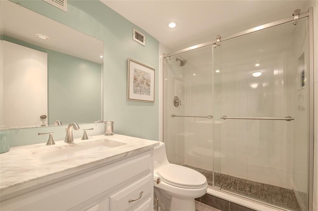 6100 Northwest 44th Street, Unit 307 Lauderhill, FL 33319 - Photo 26 of 54 a bathroom with a sink a toilet and shower