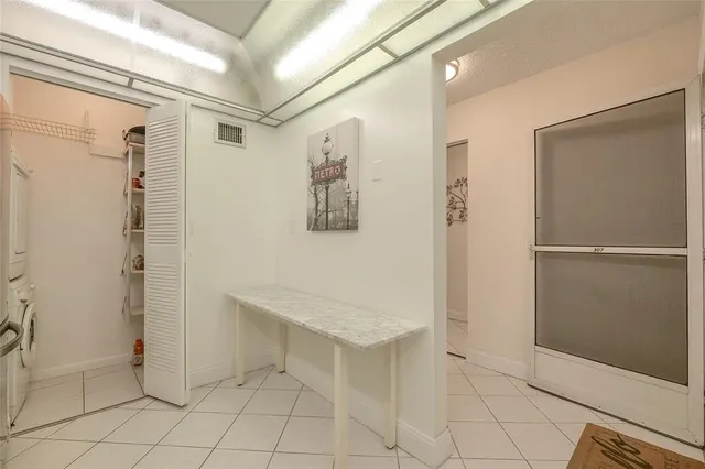 a view of a hallway with windows