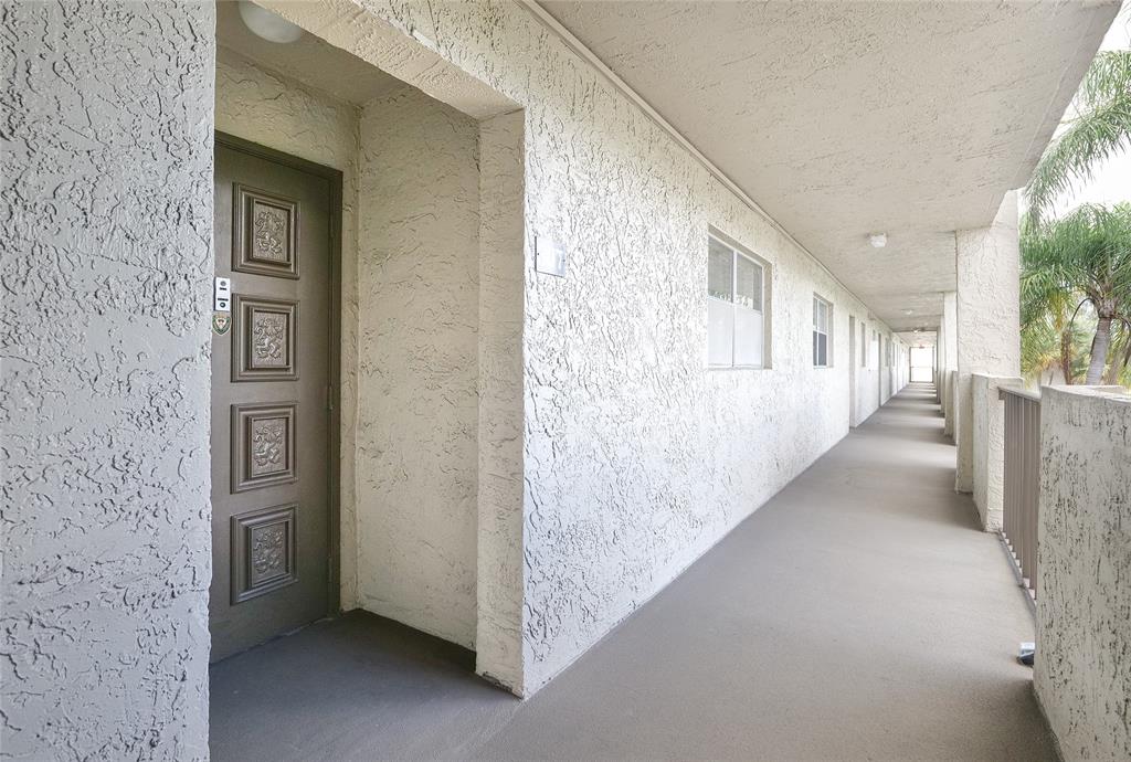 6100 Northwest 44th Street, Unit 307 Lauderhill, FL 33319 - Photo 37 of 54 a view of a hallway with windows