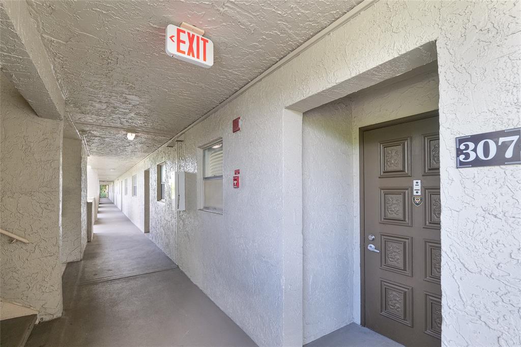6100 Northwest 44th Street, Unit 307 Lauderhill, FL 33319 - Photo 38 of 54 a view of a hallway with seating area