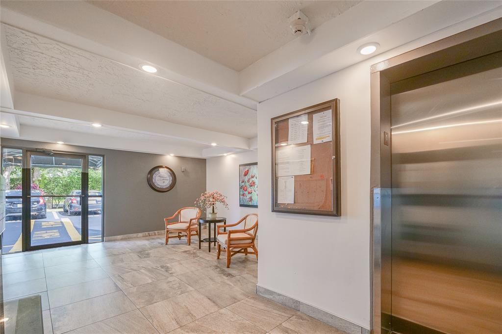 6100 Northwest 44th Street, Unit 307 Lauderhill, FL 33319 - Photo 39 of 54 a living room with furniture and a large window