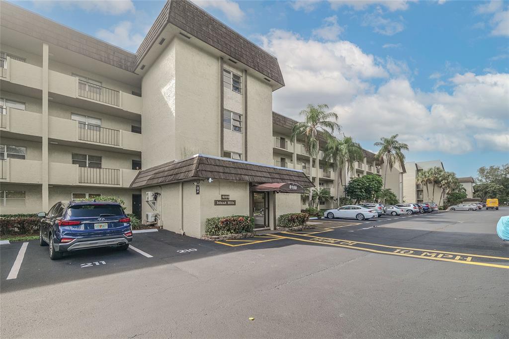 6100 Northwest 44th Street, Unit 307 Lauderhill, FL 33319 - Photo 43 of 54 a car parked in front of a building