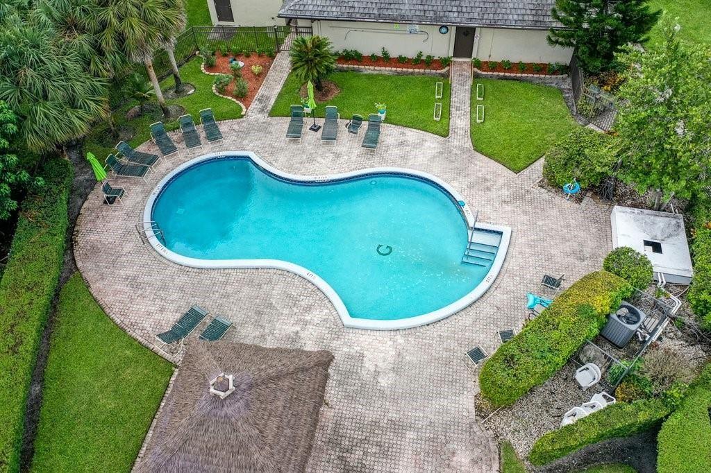 6100 Northwest 44th Street, Unit 307 Lauderhill, FL 33319 - Photo 44 of 54 an aerial view of a house with outdoor space and swimming pool