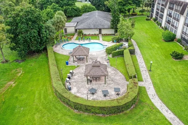 a view of a house with sitting area and garden