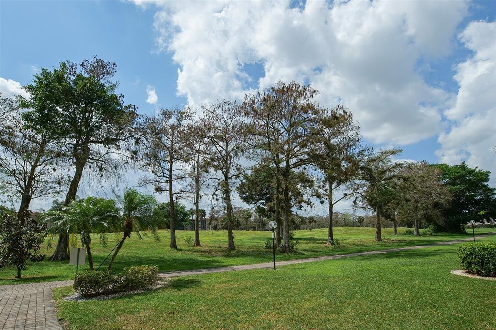 6100 Northwest 44th Street, Unit 307 Lauderhill, FL 33319 - Photo 47 of 54 a huge green field with lots of trees
