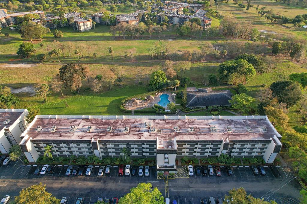 6100 Northwest 44th Street, Unit 307 Lauderhill, FL 33319 - Photo 51 of 54 an aerial view of a building with garden space and lake view